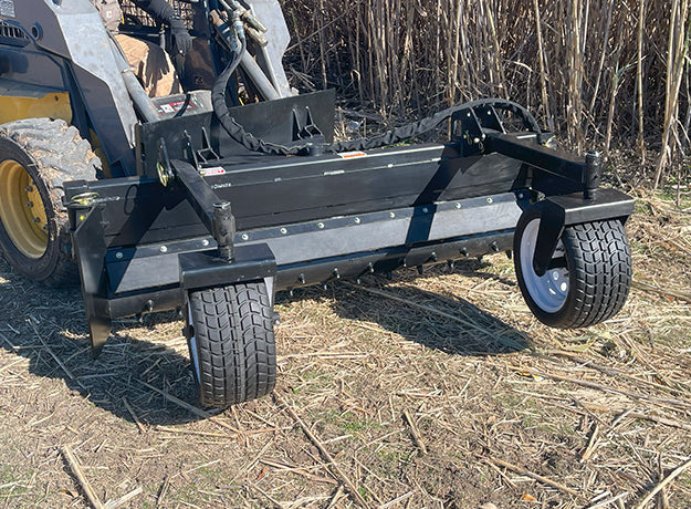 Star Industries X-Treme power rake harley rake on a skid steer grading rough ground
